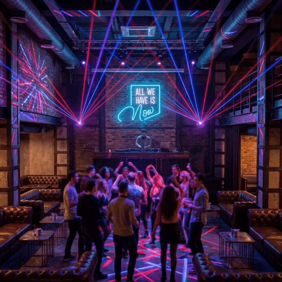 A group of people dance in a nightclub with colorful laser lights, a DJ at the booth, and the "All we have is now neon" sign glowing on the back wall.