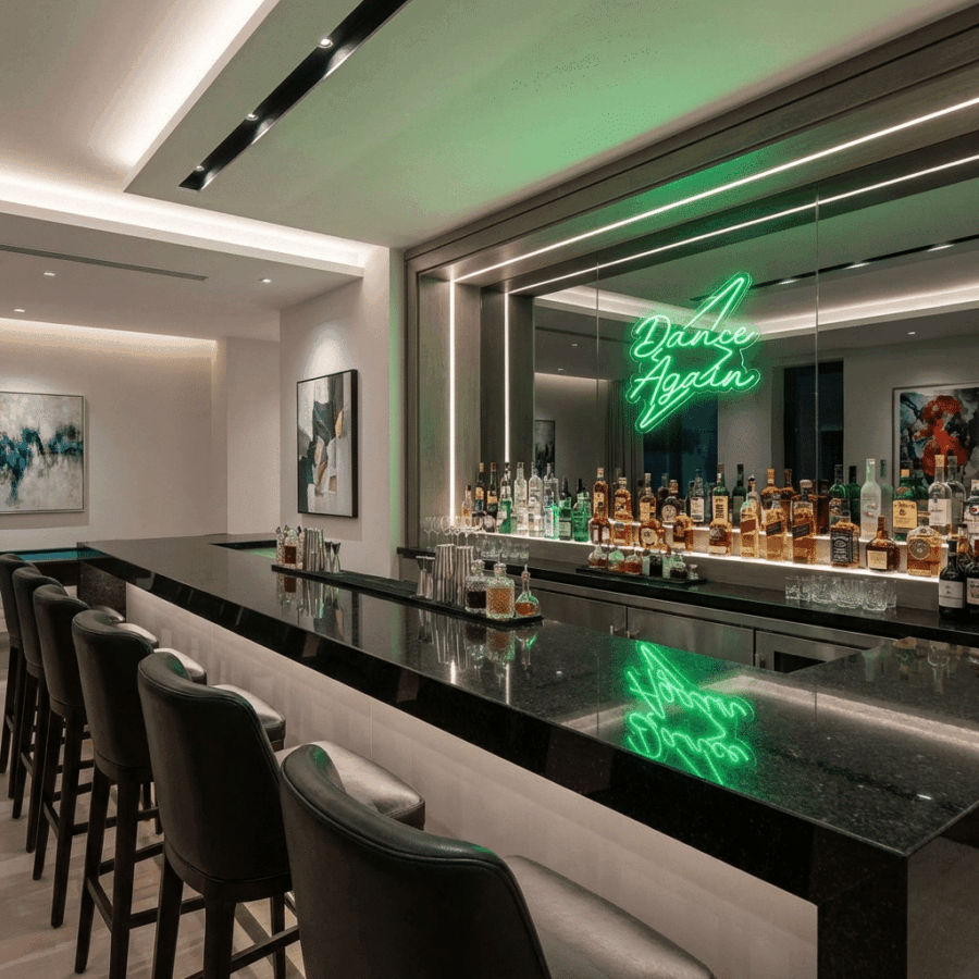 Modern bar with black countertop, high-back stools, liquor bottles, glassware, and a "Neon Dance Again" sign reflected in a large mirror. Contemporary art decorates the walls.
